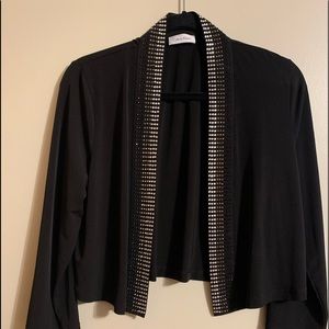 Calvin Klein Sz Med black Jersey-like open front short jacket w/metallic trim.